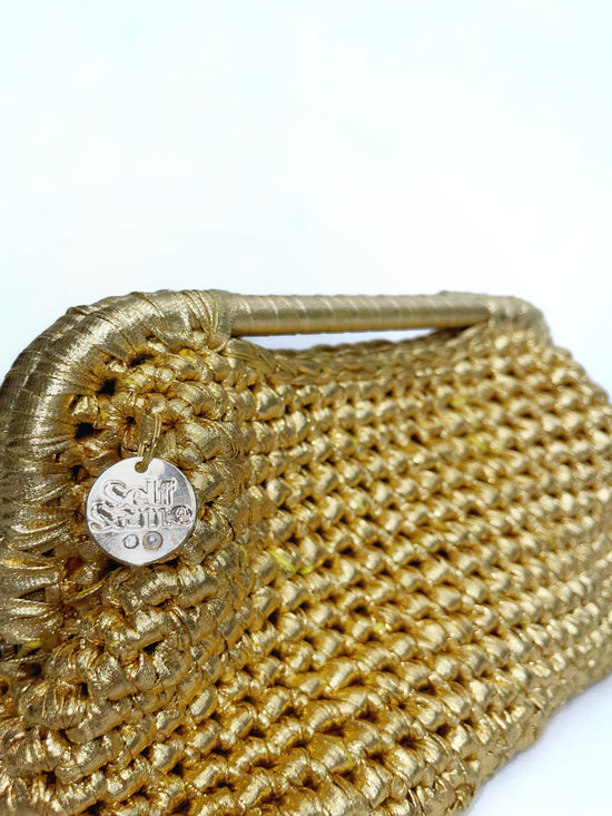 Viva metallic clutch bag in gold