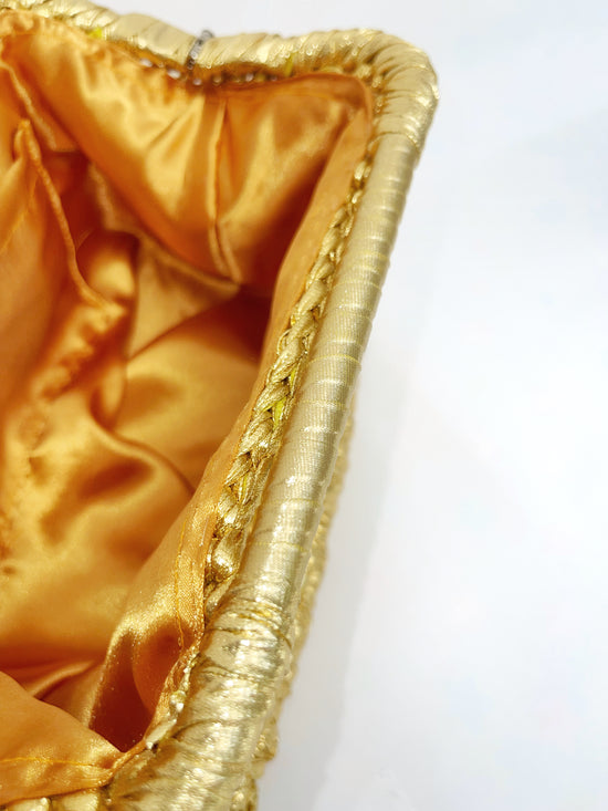 Viva metallic clutch bag in gold